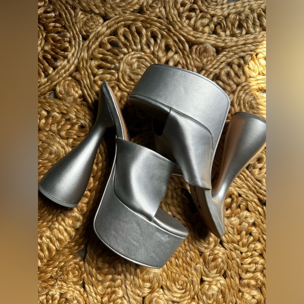 Silver platforms size 8. Can fit a 7.5. NWOT